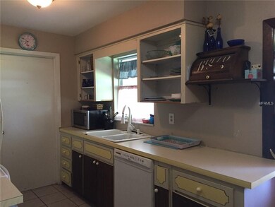 Door from kitchen leads to laundry room and conver