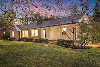 The covered front porch and updated landscaping make an excellent first impression.