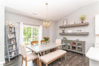 Eat-in kitchen with updated light fixtures.