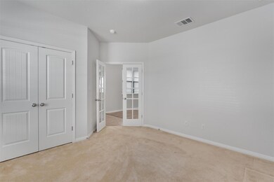 Unfurnished bedroom with carpet flooring, french 