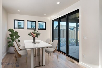virtually staged dining area with patio access