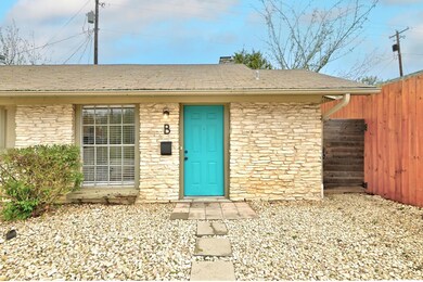 Doorway to property with roof with shingles and s