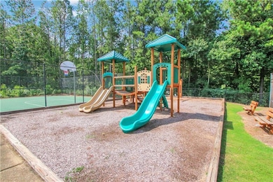 Community jungle gym with community basketball court
