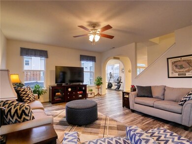 View of family room toward sunroom and kitchen