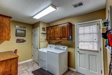 This laundry room is 13x9 has extra cabinets for s