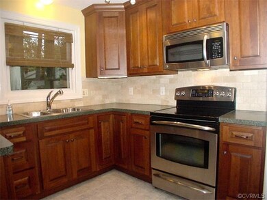 Work area of kitchen with stainless steel applianc