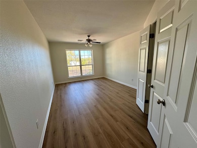 Unfurnished room featuring wood finished floors, 