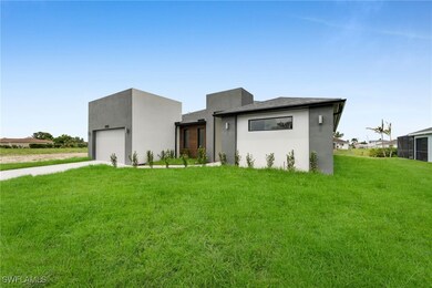 Contemporary home with a garage, concrete driveway