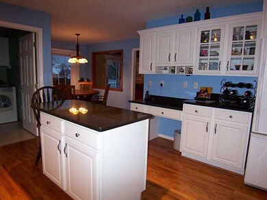 Kitchen. Planning desk and glass front cabinetry.