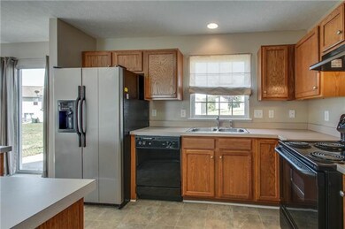Great appliance and neutral countertops add to the appeal of this well-designed kitchen.