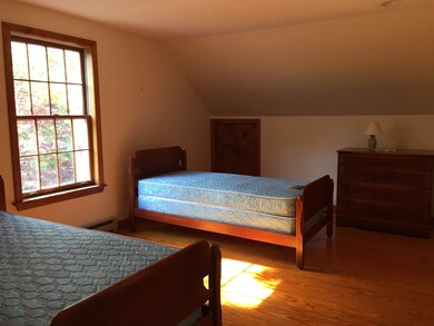 Big upstairs bedrooms with arched ceilings storage and wood floors