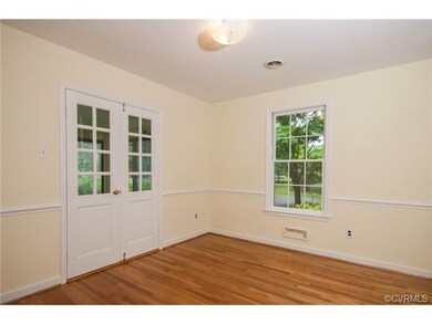Another view of the dining room with chair rail an