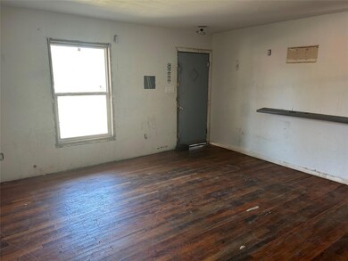 Spare room featuring dark hardwood / wood-style fl