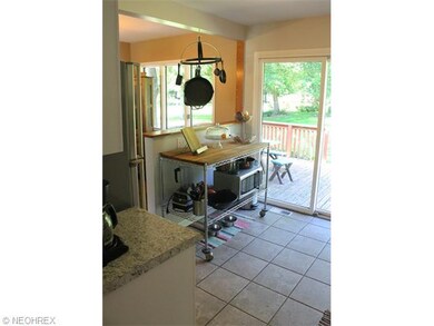 Kitchen has ceramic flooring, slider to outside, &