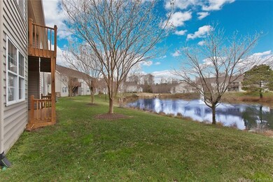 Back yard with pond & fountain view.  Lower level back deck off of kitchen & living room.