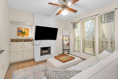 A trio of windows overlooks the enclosed patio ent