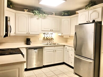 Kitchen in between the formal living and dining room