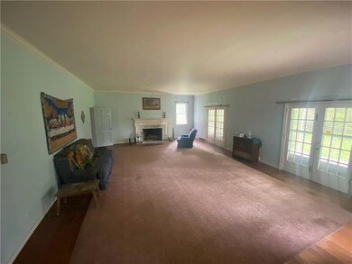 Large living room with fireplace & hardwood floors