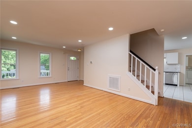Spare room featuring light hardwood / wood-style f