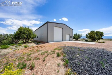View of outdoor structure featuring a garage