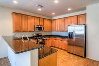 Open Kitchen with Granite Slab Counters