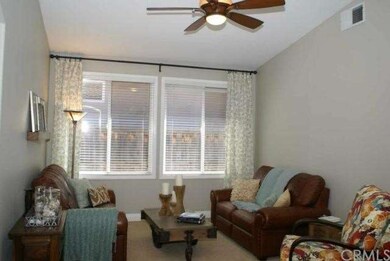 Living Room with Berber carpet, ceiling fan.