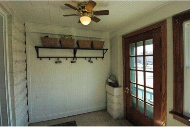 The quaint front porch has an epoxy floor covering
