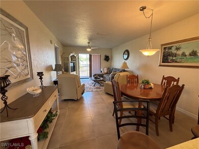 Dining space with light tile patterned floors