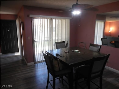 Dining area featuring ceiling fan and wood-type fl