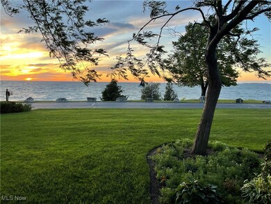 View of property's community featuring a water view and a yard