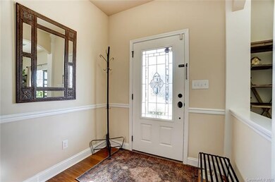 Entryway with beautiful glass inlay door