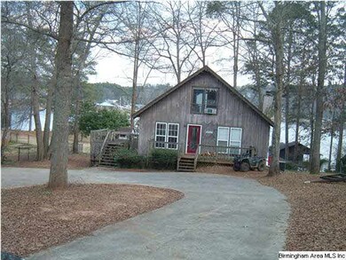 View of home from road showing the circular drive
