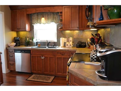 Kitchen. Opens to Dining Room, Living Room / Den, 