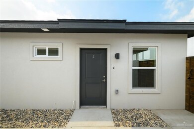 Property entrance with stucco siding