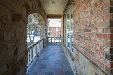 Rustic front porch with covered seating area from