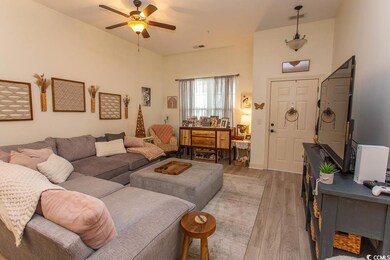 Living area with light wood-type flooring, ceiling
