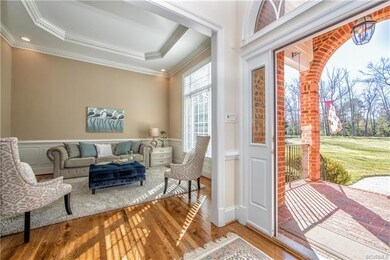Foyer welcomes you to the formal living.