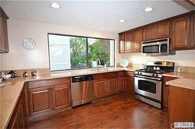Remodeled & updated gourmet kitchen. Note the stai