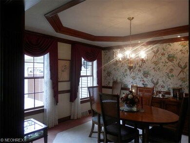 Spacious diningroom with tray ceiling, and crown m