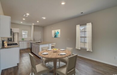 Dining space featuring dark wood-type flooring and