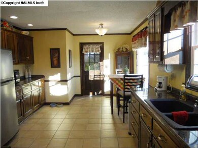 The kitchen is dine-in with new countertops,sink,and appliances.