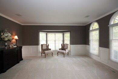 Off the foyer is the living room with new carpet, 