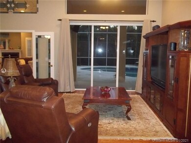 Living Room with volume 12' ceilings.