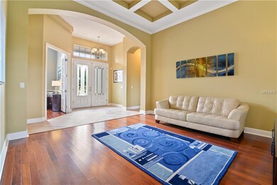 The living room looking toward the front door and 