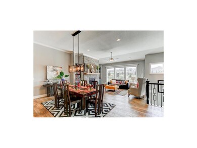 Dining area flows between the kitchen and the grea