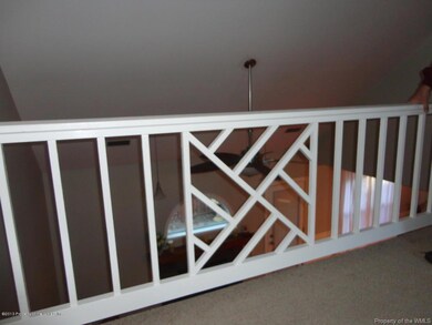 upstairs loft area overlooks family room