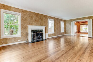 The enormous living room (27 X 14) opens to the den/family room, the butler's pantry and entry foyer.