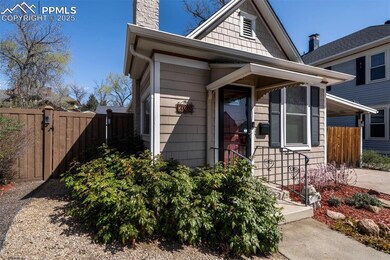 View of front of home featuring fence, cooling uni