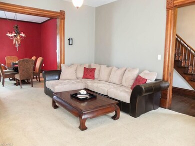 Living room with a fireplace and pocket doors to t