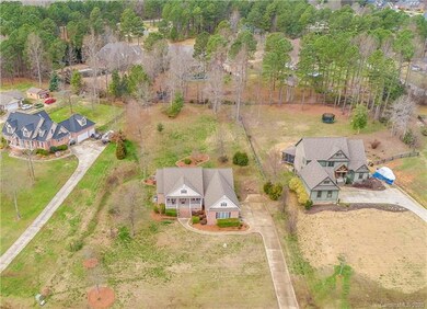 1.26 acre lot, 3-car, side-load garage.